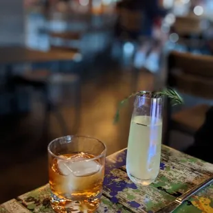 a glass of alcohol on a table