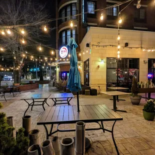 Outside. Storefront and patio. Located in the East Main Square development. Free surface and deck parking. Read the signs for restrictions.