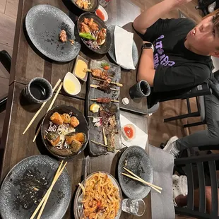Skewers, fried tofu, udon, chicken.