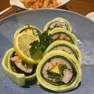 a plate of sushi rolls