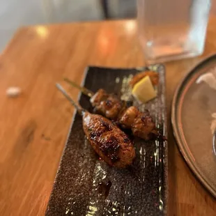 Chicken meatball and negima skewer