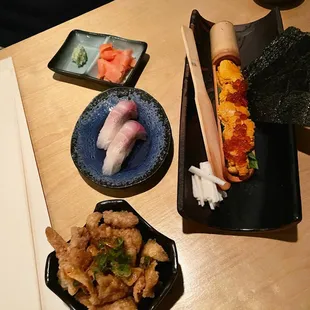 Hokkaido uni with ikura, yellowtail sushi, fried chicken skin. YUMM!