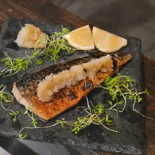 grilled fish on a slate plate