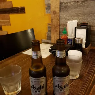 two bottles of beer on a table