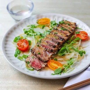 Sliced, seared, and sensational: experience Japanese Tataki delight at Izakaya NoMad.

Hamachi Tataki consists of a seared yellowtail with