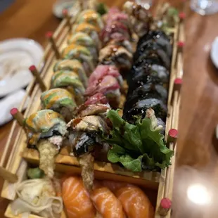 a wooden tray of sushi