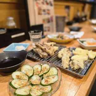 Pickled cucumbers, eel tempura, squid tempura, mushroom tempura