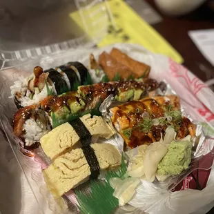 2 Piece Tamago Nigiri Lion King Roll Dragon Roll 5 Piece Tempura Roll 2 Piece Inari Nigiri  Sushi takeout Goodness !