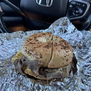 Steak egg n cheese on a garlic bagel $8 (instagram: @issa.cheatday)