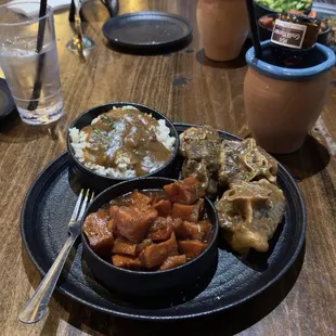 Oxtail, yams, and rice with gravy. Yams were the perfect amount of sweet to match the savory of the other two.