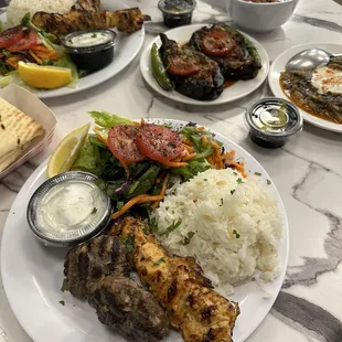 Chicken and meatball kebab, eggplant stuffed ground beef, sautéed spinach with yogurt, Turkish pozole, and chicken kebab