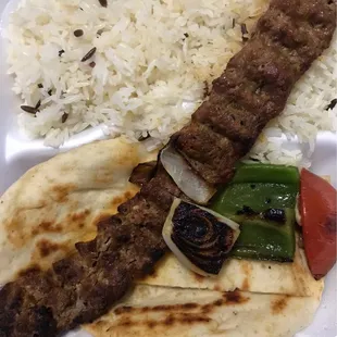 Adana Kebab w/ pita, onions, peppers and Turkish pilaf rice mixed with orzo.