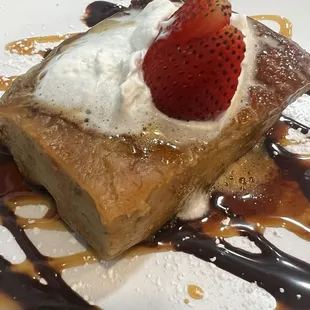 Bread pudding with caramel and chocolate sauce.