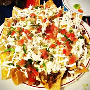 The Nachos Mixtos! topped with LOTS of ingredients