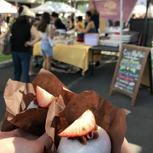 Izu's mochi tent and two large daifuku mochi with whole strawberries inside!