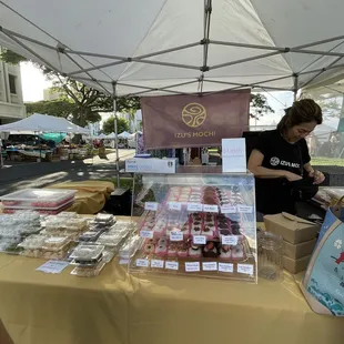 a woman at an outdoor market