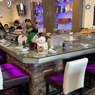 a restaurant with a long counter