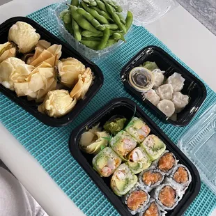 Money bags (left), edamame (top left), spicy shrimp avocado and spicy salmon rolls, and shrimp shumai