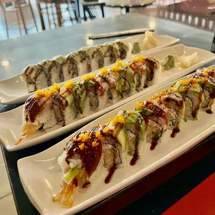 Dragon roll imitation crab and tempura shrimp inside topped with eel