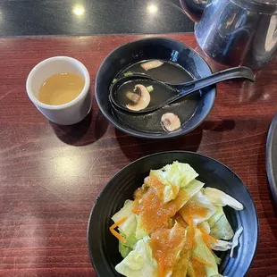 Salad and mushroom broth soup