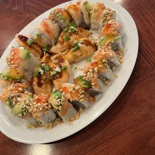 Seared salmon,Oregon roll and rainbow rolls topped with peanut
