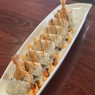 Tempura shrimp roll topped with spicy mayo and teriyaki sauce