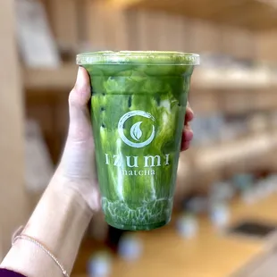 honey matcha oat milk latte with extra matcha shot