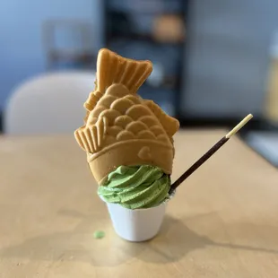 Matcha and Vanilla Swirl Soft Serve with Taiyaki Fish, Pocky, and Matcha Powder Toppings