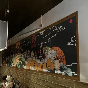 The mural along the back of the hibachi area.