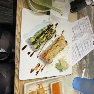 miso soup, sushi, and spring rolls