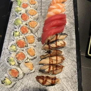 Spicy tuna spicy salmon and avocado rolls with unagi, salmon and tuna nigiri