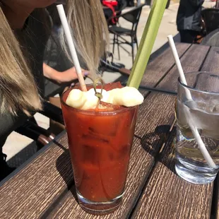 a bloody drink and a glass of water