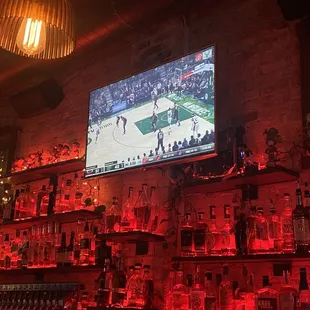 a bar with a large screen tv
