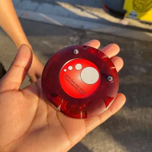 a hand holding a red light