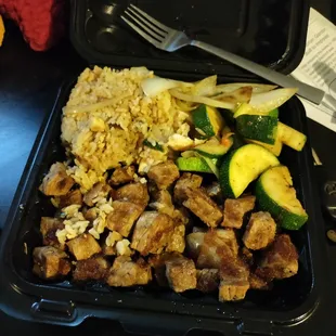 Overcooked Hibachi Steak with a measly scoop of rice and basic $2 veggies that I was charged out the @$$ for.