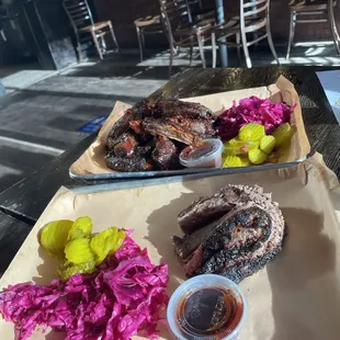 Smoked Brisket (Front), Dino Ribs (Back)