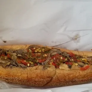 Serious cheese steak with shrooms and peppers. Very good.