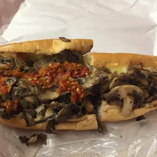 Fresh mushrooms and a killer spicy pepper spread with the perfect amount of meat to cheese/bun ratio.  30 years of business
