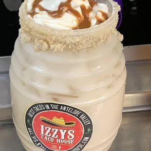 caramel and whipped cream in a jar