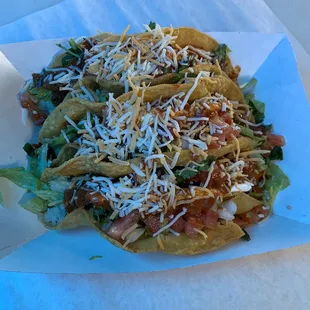 a taco with cheese and lettuce
