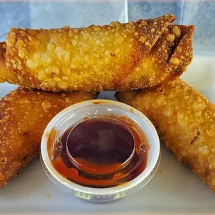 Pulled pork eggrolls 3/ $6.25 These are filled with meat and blend of 6 different cheeses and served with a side of BBQ.