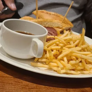 French dip prime rib sandwich with fries and