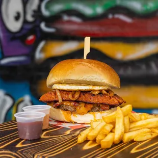 Heart Attack Burger, handmade beef patty, topped with cheddar cheese, crispy bacon, grilled onions, fried egg &amp; chorizo.