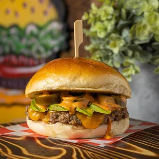 Mexican Burger, handmade beef patty, topped with cheddar cheese, avocado, jalapenos, &amp; chipotle mayo.