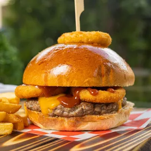 New York Burger, Handmade Beef Burger,topped w/ cheddar cheese, Crispy onion Rings &amp; BBQ sauce