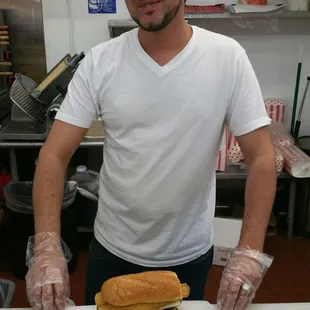 a man holding a sandwich