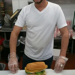 a man holding a sandwich