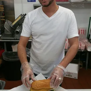 a man holding a sandwich