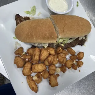 Ribeye steak sandwich and cheese curds.
