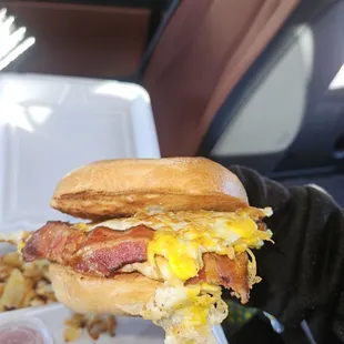 Bacon, egg, and cheese bagel with house fries.